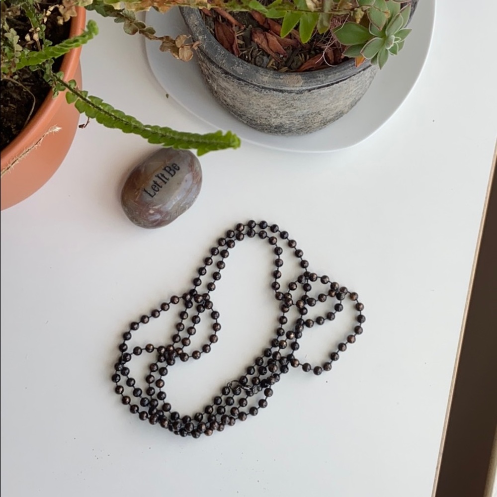 String of Brown Beads, Layer